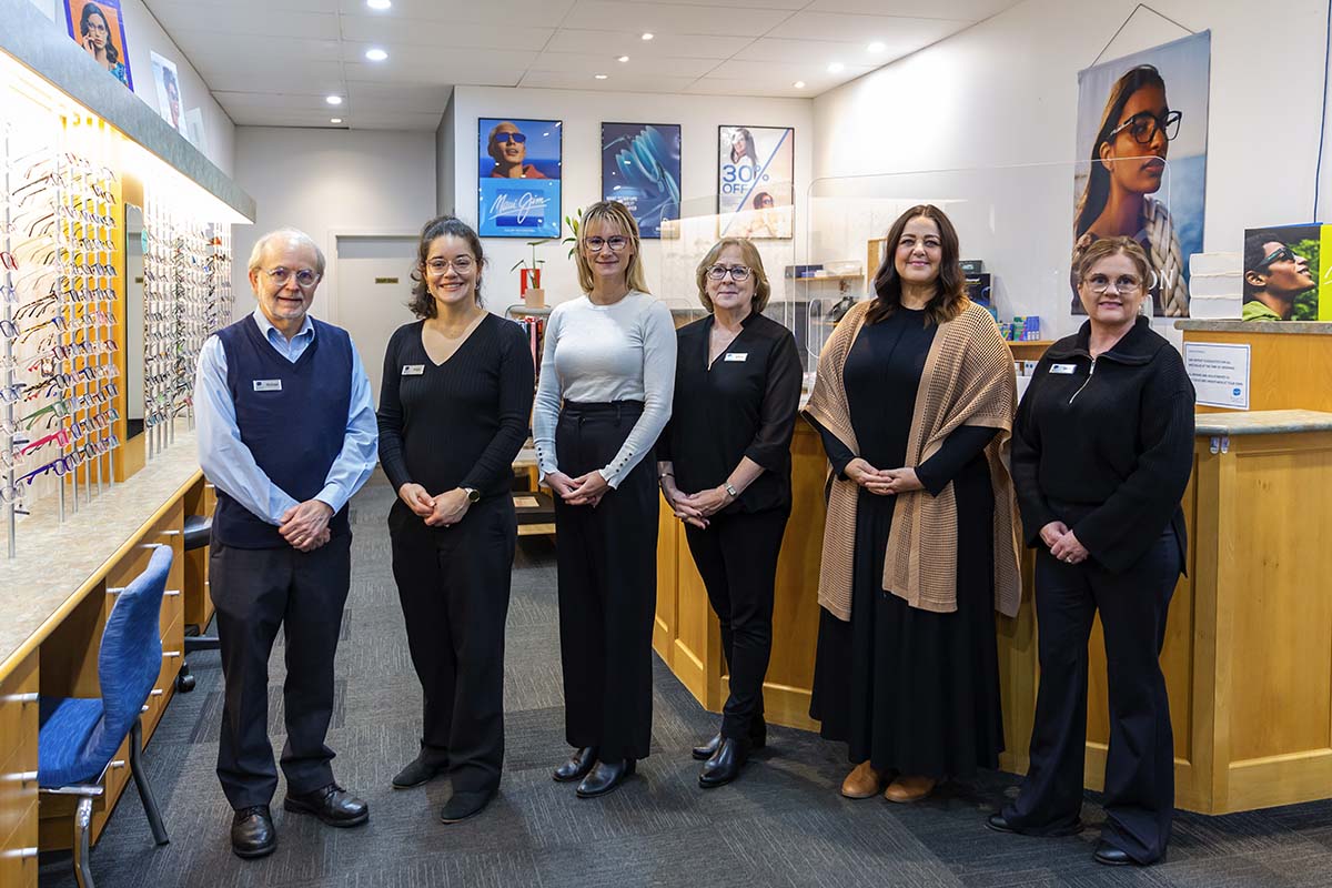 Professional eye care team at Yarra Junction Optical posing at the shop.
